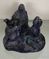 full view of soapstone carving showing figures and seals