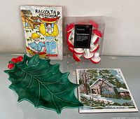 Full lot showing both ceramic trivets, boxed Decoris mushroom ornaments, green holly leaf dish
