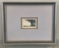Front view of framed monochrome landscape painting