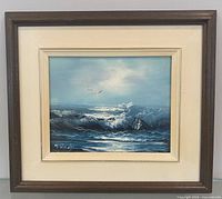 Front view of framed ocean oil painting