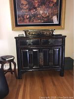 Front view of the cabinet with decorative tray on top