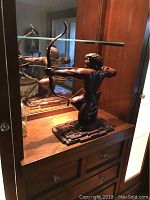 Front three-quarter view showing full figure, bow and base