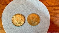 Both Kennedy half dollars obverse sides