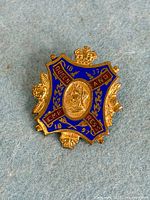 Front view showing crest design, enamel colours and portrait