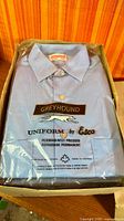 Sealed Greyhound uniform shirt showing packaging and logo