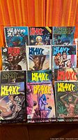 Front view of all nine bagged Heavy Metal magazines on display