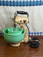 Full view of mixer with both bowls, beaters installed and cord coiled