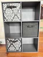 front view showing six cubes and three fabric bins