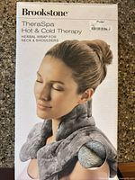 Front of box showing Brookstone TheraSpa neck & shoulder wrap