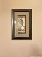 Front view of first framed print on wall