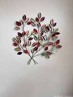 Full view of metal leaf wall art on wall