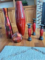 Full set of six glazed ceramic candle holders displayed together
