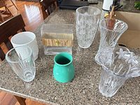 Group shot of all six vases on countertop