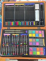 Overall view of open wooden case showing all contents