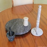Set showing marble paper towel holder, marble salt shaker, stone mortar & pestle, stone lazy Susan