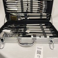 Open case showing full utensil set strapped in place