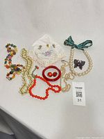 All jewelry items grouped together on table