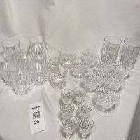 Full group of assorted crystal glasses displayed