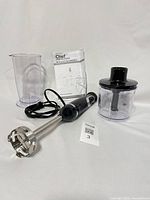 Complete set showing motor body, blending shaft, chopper bowl, measuring jug and manual