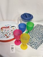 Group shot of tray, glasses, pitcher and folded tablecloth