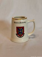 Front view showing crest, wording and gold rim