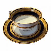teacup, saucer and plate showing cobalt blue and gold pattern