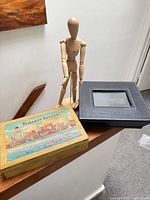 All three items together: mannequin, black photo box, Toronto wood box