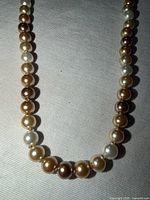 Mid-section of necklace displaying alternating pearl colours
