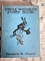 Front cover of blue cloth hardcover showing title and illustration