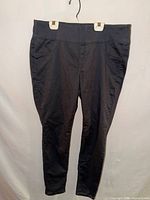 Front view of black jegging hanging