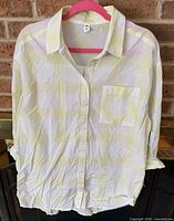 Front view of yellow and white BP Nordstrom blouse on hanger