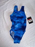 Front view of blue Nike girls one-piece swimsuit with tags