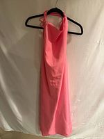 Front view of pink Bardot dress on hanger