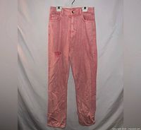 Full view of pink ripped jeans front side