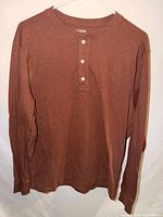 Front view of brown long sleeve Henley T-shirt
