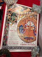 Full view of poster on red surface showing overall design and text