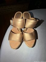 Top view of both gold wedge heels