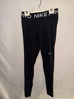 Full view of black Nike Pro leggings front side