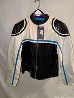 Front view of black and white jacket with blue stripes on hanger