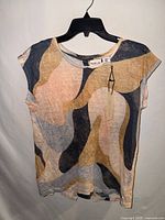 Front view of Rachel Zoe linen T-shirt with tags visible