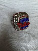 Front view of replica Phillies championship ring showing Phillies logo in red and blue stones
