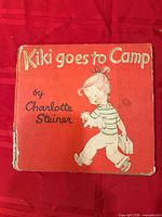 Front cover showing title, author and illustration, visible edge wear