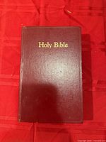 Front cover of red Holy Bible