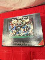 Front of boxed Epyx Play Action VCR Football game showing title graphics