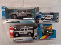 Front view of all four boxed vehicles