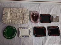 Overview of eight items laid out on cloth