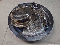 Platter with covered dish, salver trays and utensil bundle