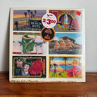 Front cover of sealed LP with artwork and price stickers visible