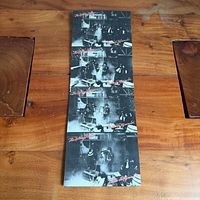 Front view of entire postcard sheet showing twelve images