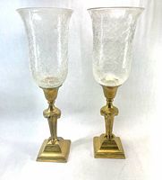 Full view of both brass candlesticks with crackle glass shades